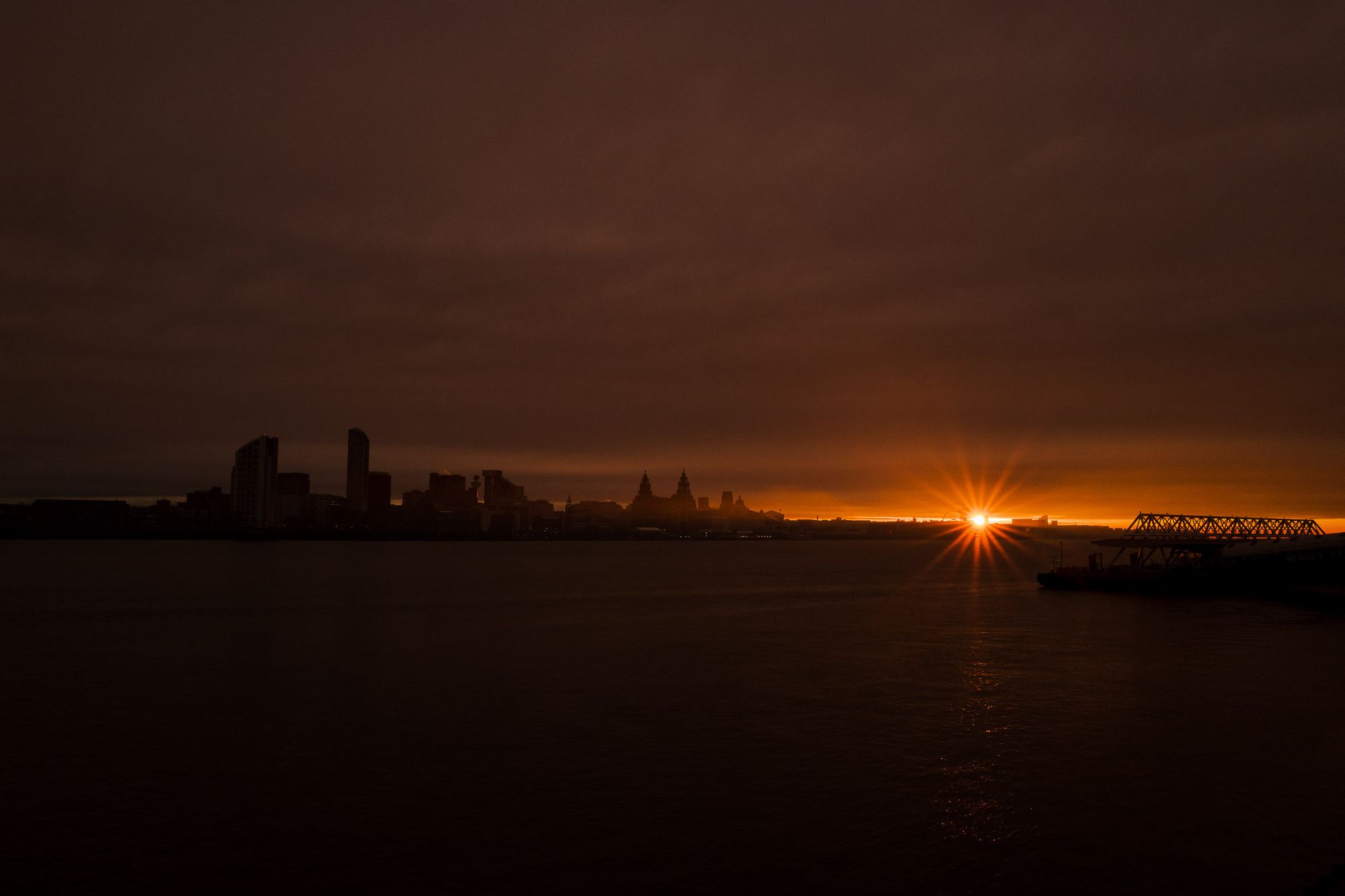 Sunrise over the city of Liverpool taken from across the River Mersey.