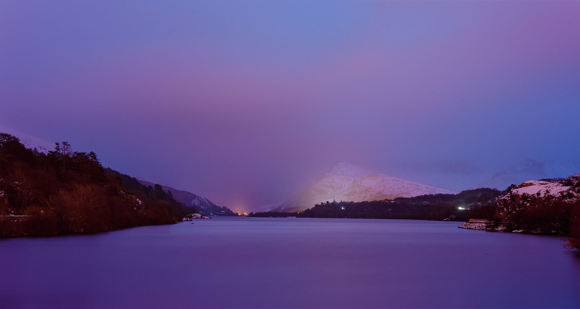 Purple dusk sky over Snowdonia mountains viewed from Lake Pardarn.